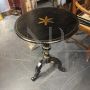 Small antique Tuscan round table, lacquered in black with gold details, early 19th century