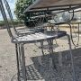 Garden set with 6 chairs and a large wrought iron table