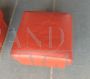 Pair of ottomans designed by Matteo Grassi in orange leather