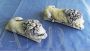 Pair of small sculptures of sleeping lions, inspired by Antonio Canova