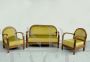 Art Deco living room with mustard yellow velvet sofa and armchairs   