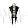 Design black chair in white leather with fan-shaped backrest
