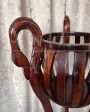 Art deco wooden plant stand with carved swans