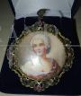 Liberty pendant or brooch in gold, silver and rubies with portrait of a lady