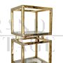Design bookcase with cubes in brass and glass