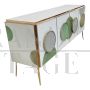 Illuminated sideboard in white glass with green circles