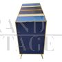 Dresser with 4 drawers covered in blue, white and yellow glass