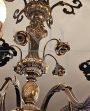 Large vintage bronzed brass chandelier with floral decorations