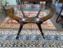 Mid-century round wooden table with glass top