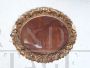 Oval mirror frame in carved and gilded wood, early 20th century