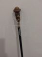Wooden walking stick with resin and silver character