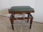 Adjustable vintage piano stool in wood and green skai