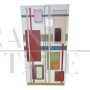 Wardrobe or pantry cabinet in colored glass with illuminated mirror interior