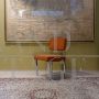 Vintage chair in metal and orange fabric