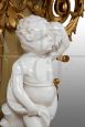 Antique console in gilded and carved wood with cherub sculpture