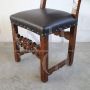 Antique chair in carved walnut and brown leather