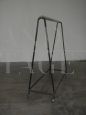 Vintage industrial stander clothes hanger with wheels from the 1950s