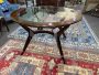 Mid-century round wooden table with glass top