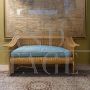 Bamboo and wicker sofa with light blue cushion