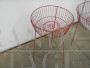 Pair of vintage red metal shop display baskets, 1960s
