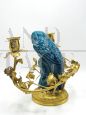 Vintage gilt bronze candelabra with blue porcelain parrot