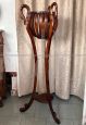 Art deco wooden plant stand with carved swans