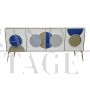 Illuminated sideboard in white glass with blue circles