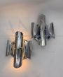 Pair of chromed wall lights attributed to Reggiani, 1970s design                            