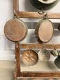 Antique 20th century plate rack with copper objects