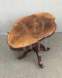 Antique oval biscuit coffee table from the 19th century