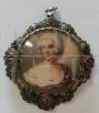 Liberty pendant or brooch in gold, silver and rubies with portrait of a lady     