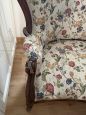 Antique carved sofa in floral fabric