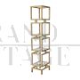Design bookcase with cubes in brass and glass
