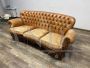 Vintage Chippendale leather sofa with tufted backrest