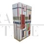 Wardrobe or pantry cabinet in colored glass with illuminated mirror interior