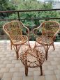 Set of two vintage wicker armchairs and coffee table