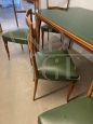 Mid-century living room set with table with glass top and green skai chairs