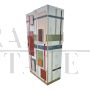 Wardrobe or pantry cabinet in colored glass with illuminated mirror interior