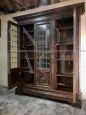 Large 1950s walnut bookcase with leaded glass doors