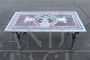 Iron garden table with marble top with mosaic decoration