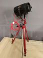 Small vintage cinema spotlight with tripod