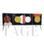 Backlit sideboard in black glass with colored circles