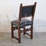 Antique chair in carved walnut and brown leather