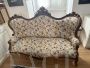Antique carved sofa in floral fabric