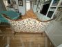 Antique carved sofa in floral fabric