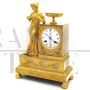Empire Parisian clock in gilt bronze, signed and dated 1819