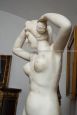 Antique sculpture in white statuary marble with a female subject