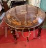 Palladian crank-extendable table with inlays of flowers and musical instruments