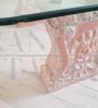 Vintage low coffee table with sculpted pink granite legs and glass top