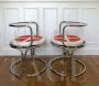 Pair of armchairs by Gae Aulenti in chromed steel                            